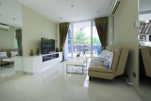 1 Bedroom Apartment | Living room | 42-inch flat-screen TV with cable channels, TV