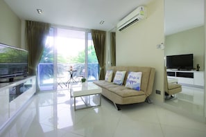 1 Bedroom Apartment | Living room | 42-inch flat-screen TV with cable channels, TV