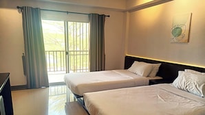 A hotel room with two beds, a large window with curtains, a wall-mounted artwork, and a tiled floor. - Smile Place Hotel Chiang Rai (Chiang Rai)