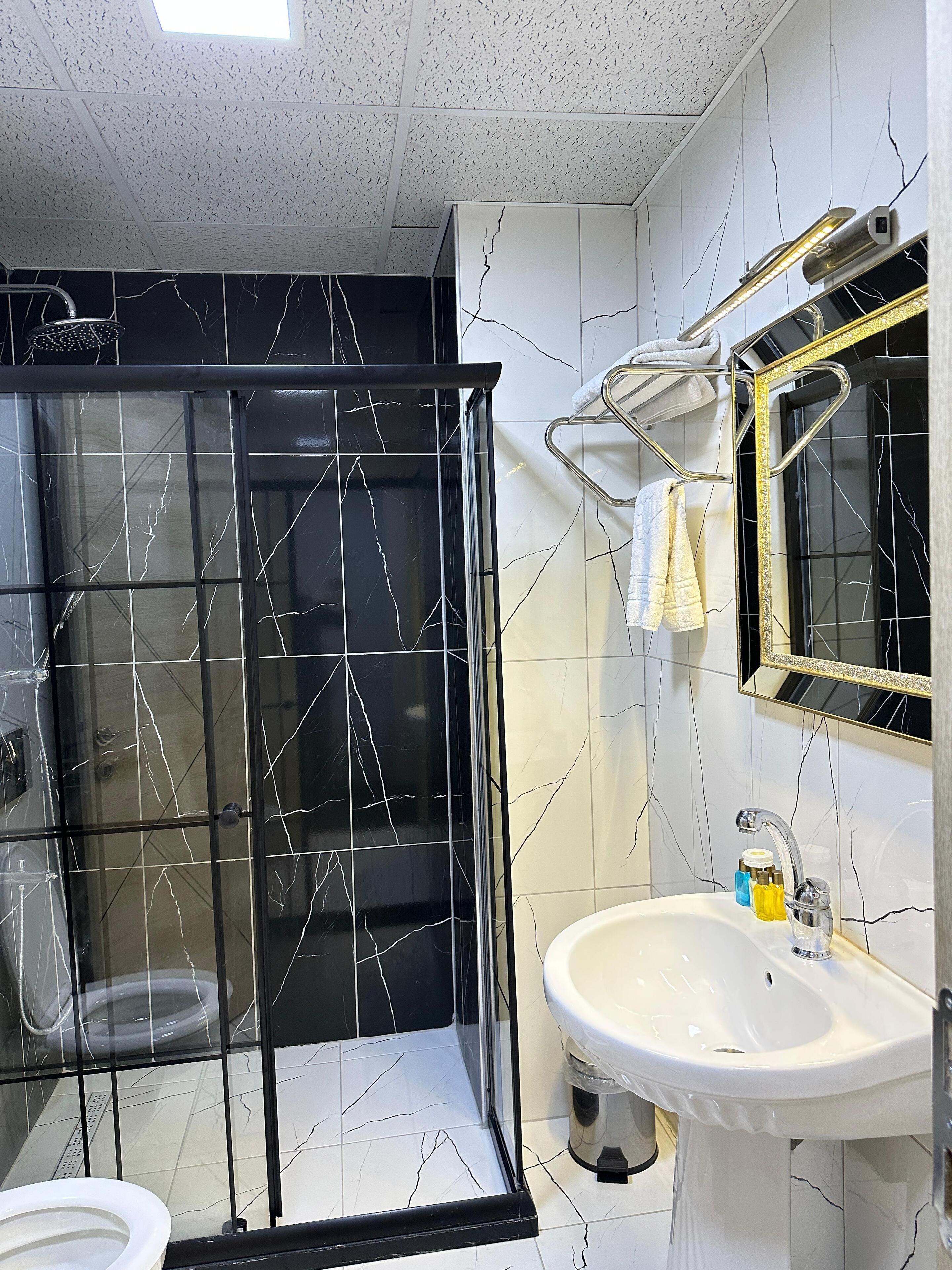 shower, eco-friendly toiletries, hair dryer, slippers