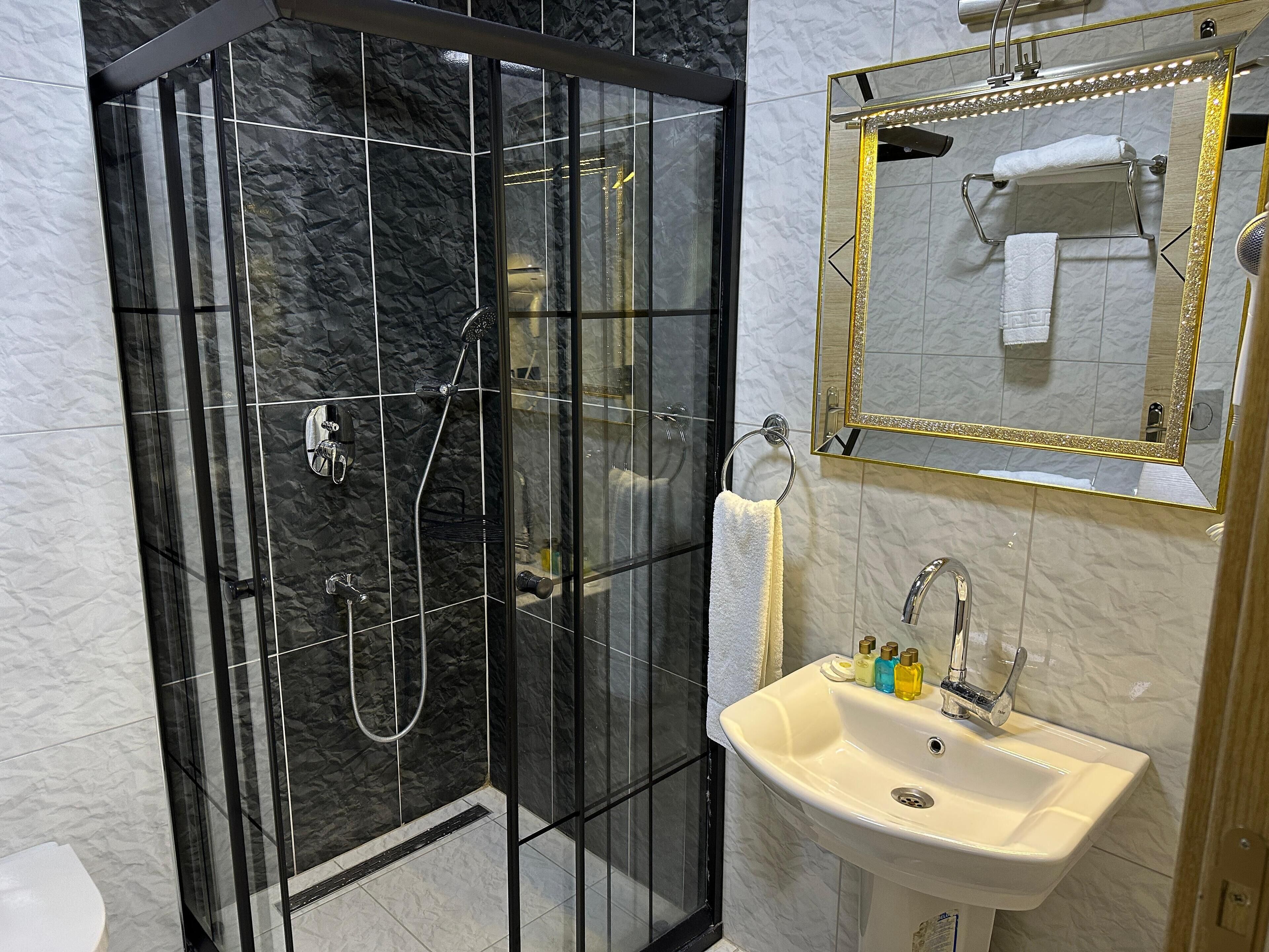 shower, eco-friendly toiletries, hair dryer, slippers