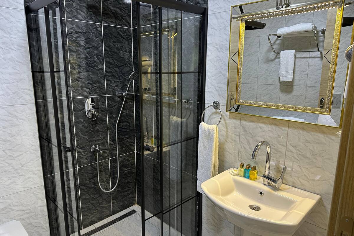 shower, eco-friendly toiletries, hair dryer, slippers