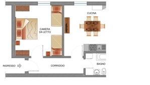 Un plan d’étage d’une chambre d’hôtel comprenant un lit, une salle de bain, un coin cuisine et un espace repas.