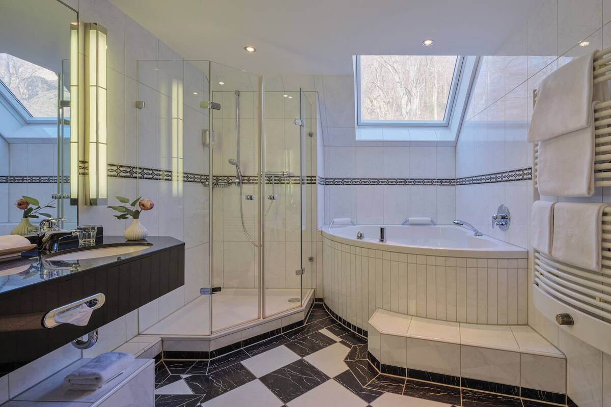 separate bathtub and shower, deep-soaking bathtub, rainfall showerhead