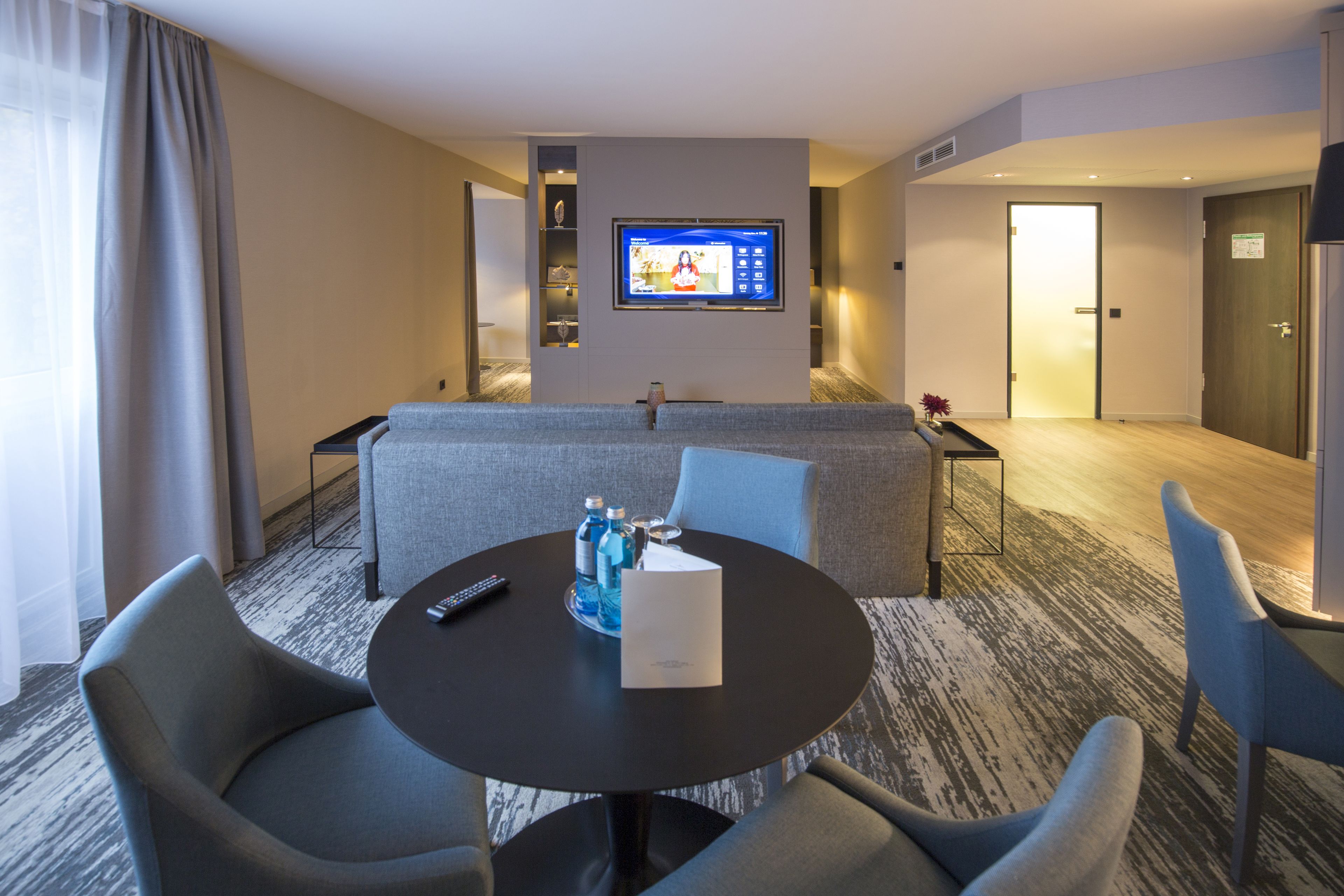 junior suite | living area | 49-inch flat-screen tv with cable channels, tv, tablet