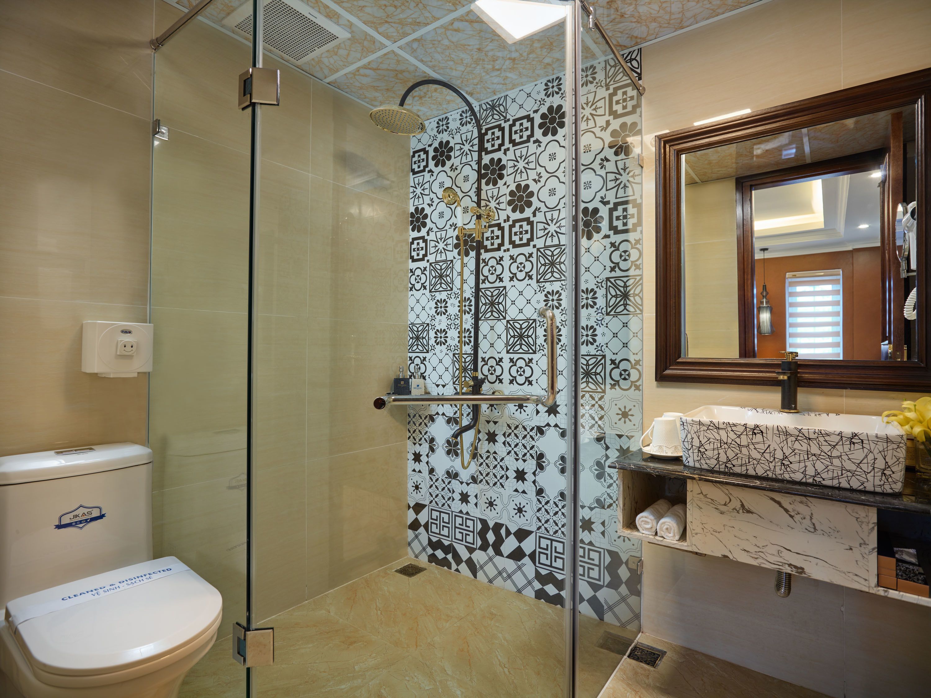 premier deluxe family room | bathroom | separate bathtub and shower, rainfall showerhead, free toiletries