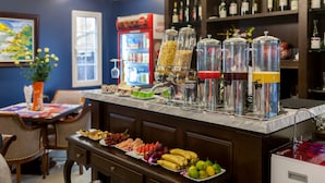 A bar area with a marble countertop, various food items, and a wine rack. - Eden Boutique Hotel & Spa (Sa Pa)