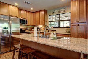 House, 4 Bedrooms | Private kitchen | Full-sized fridge, microwave, oven, stovetop - Leaning Oak PRD923 by RedAwning (New Braunfels)