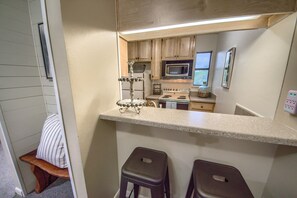 Condo, 2 Bedrooms | Private kitchen | Fridge, microwave, oven, stovetop