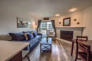 Condo, 1 Bedroom | Living room | TV, fireplace - Grandma's River Haus Rrc A108 1 Bedroom Condo by RedAwning (New Braunfels)