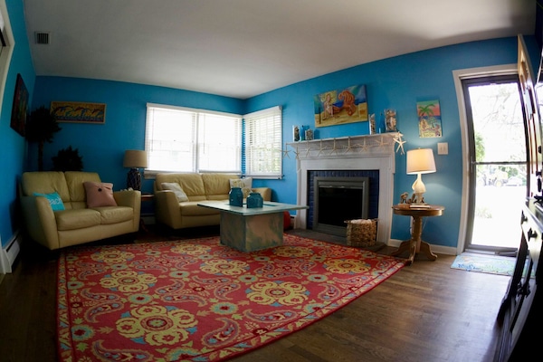 Living room has leather sofa and loveseat.