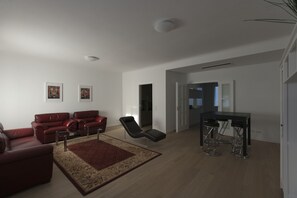 Apartamento de lujo, 2 habitaciones, cocina | Zona de estar | Una televisión de pantalla plana