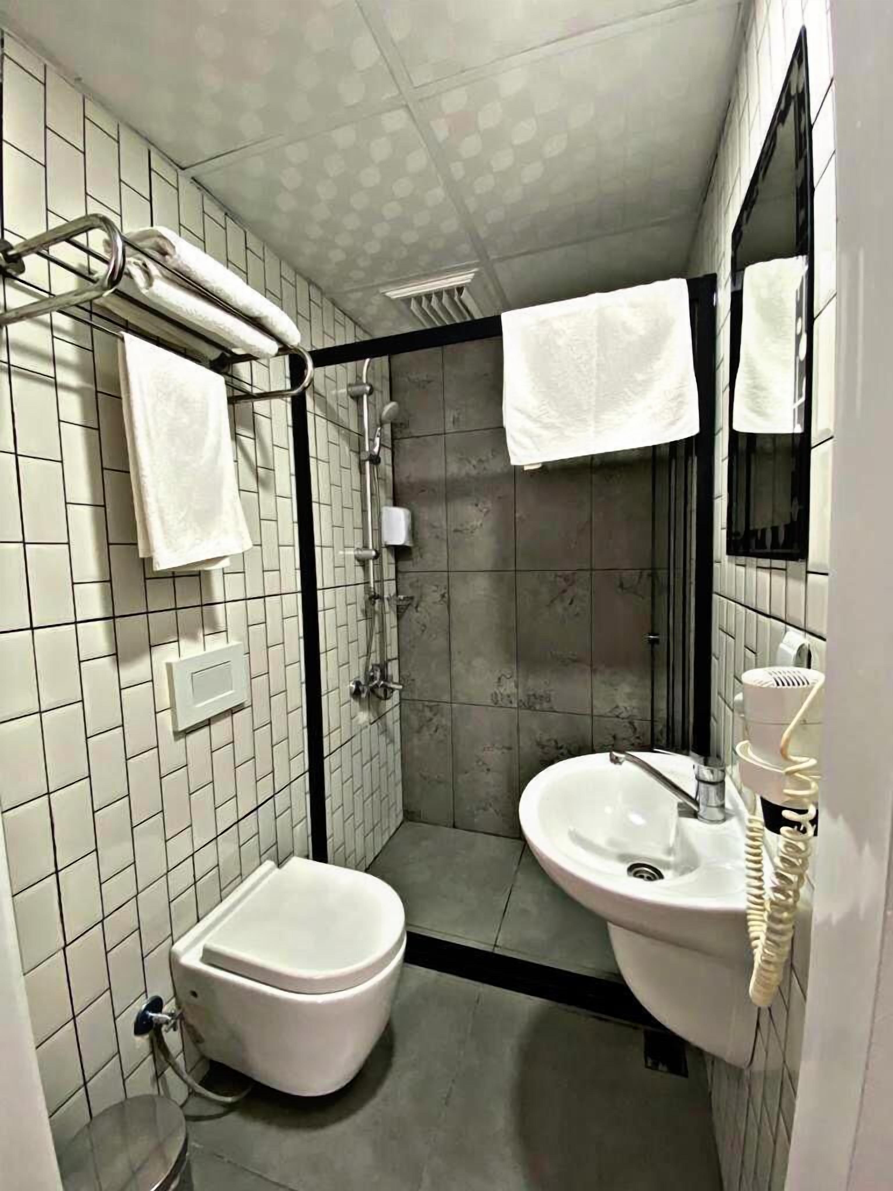 family room | bathroom | shower, free toiletries, hair dryer, towels
