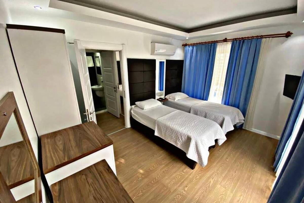 family room | 1 bedroom, desk, soundproofing, iron/ironing board