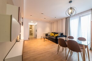 Standard Apartment, 1 Bedroom, Balcony | Living room | 60-cm flat-screen TV with cable channels, TV