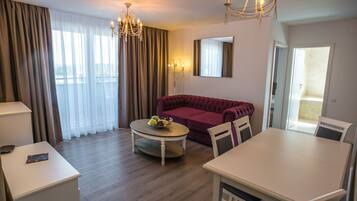 Standard Apartment, 1 Bedroom, Balcony | Living room | 60-cm flat-screen TV with cable channels, TV