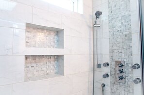 Combined shower/tub, hair dryer, towels, soap