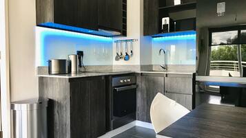 Standard Apartment, 1 Queen Bed | Private kitchen | Full-sized fridge, oven, stovetop, cookware/dishes/utensils