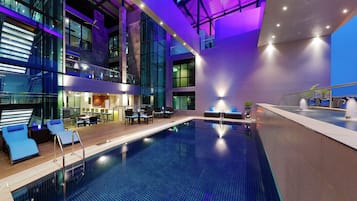 Indoor pool, open 7 AM to 6 PM, pool umbrellas, pool loungers