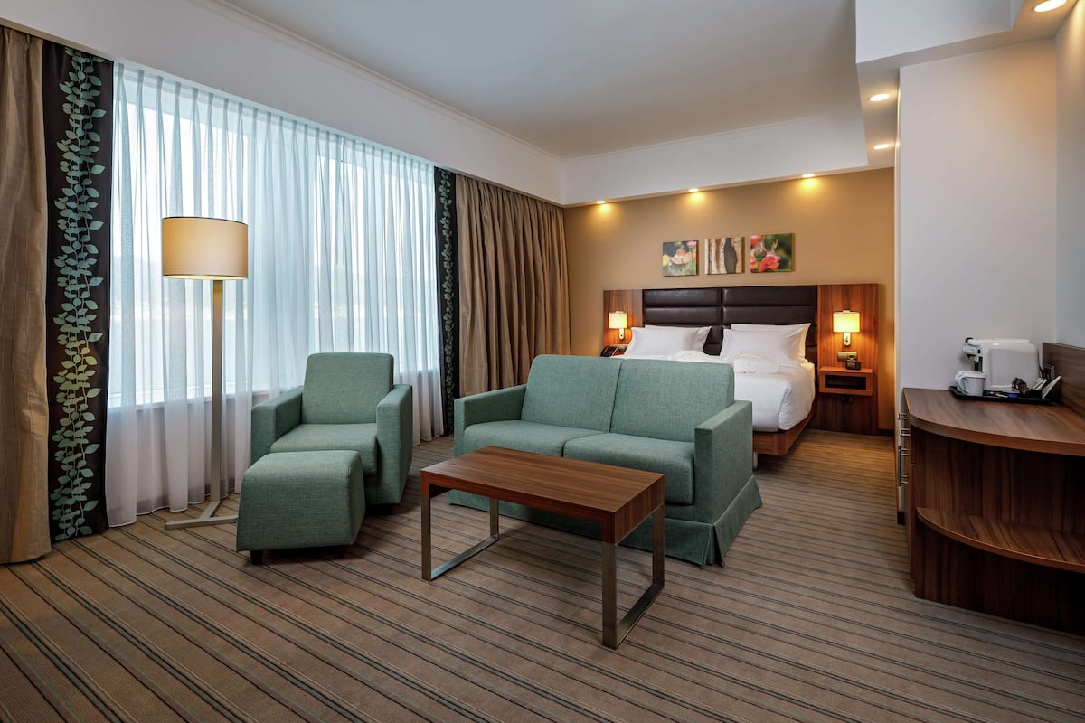 Deluxe Room, 1 King Bed, Sea View | Living area | LCD TV