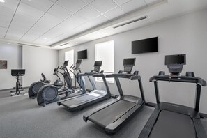 A fitness center with treadmills, elliptical machines, and stationary bikes. - Home2 Suites by Hilton Dallas DeSoto (DeSoto)