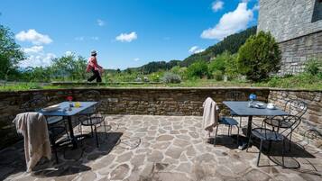 Relax on the patio with a view of the surrounding hills.