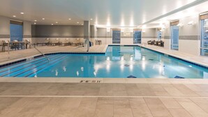 An indoor swimming pool with clear lane markings, a tiled floor, and a sign indicating a 3 ft 6 in depth. - Hampton  Inn & Suites Indianapolis-Keystone (Indianapolis)