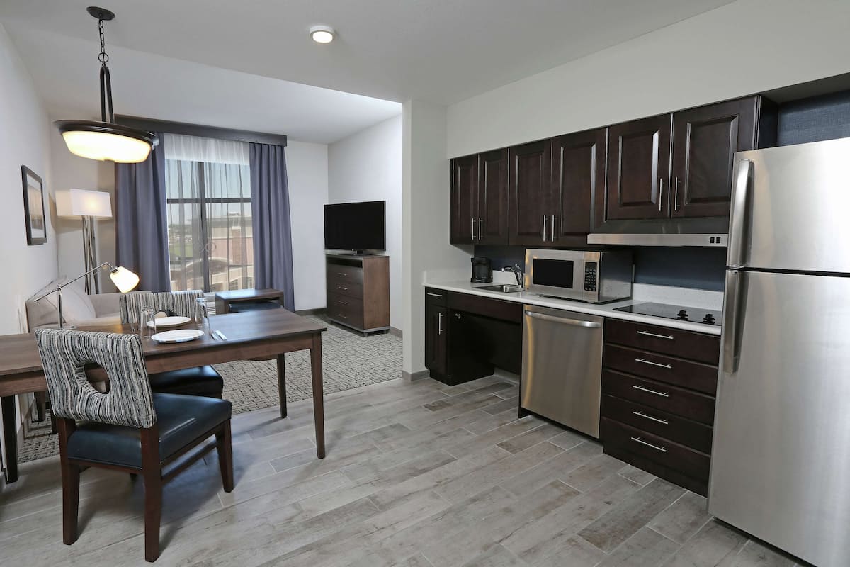 full-sized fridge, microwave, stovetop, dishwasher