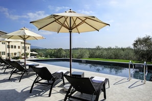 Seasonal outdoor pool, pool umbrellas, sun loungers