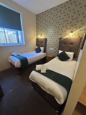 City Twin Room | Premium bedding, desk, iron/ironing board, cots/infant beds