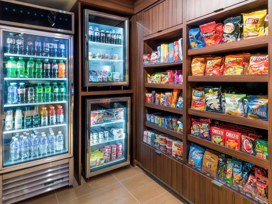 A vending machine area with various snacks and beverages.