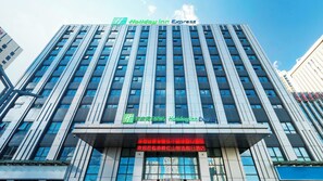 A multi-story building with a prominent Holiday Inn Express sign at the top. - Holiday Inn Express Chifeng Hongshan by IHG (Chifeng)