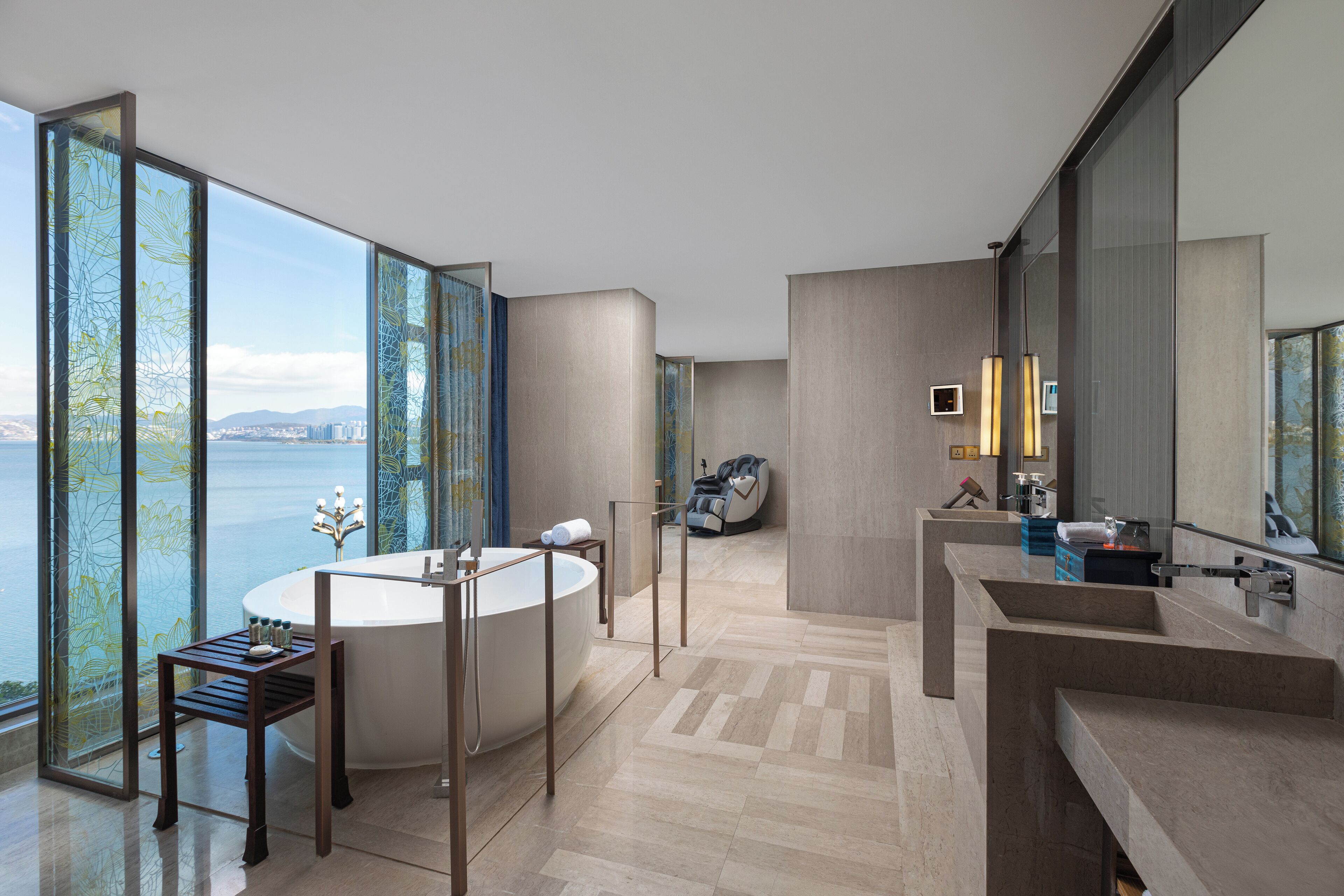 A modern bathroom with a large bathtub, a separate shower area, and a vanity with a large mirror.