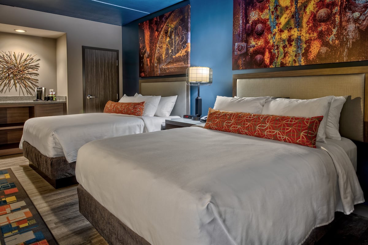 Premium bedding, desk, laptop workspace, blackout curtains