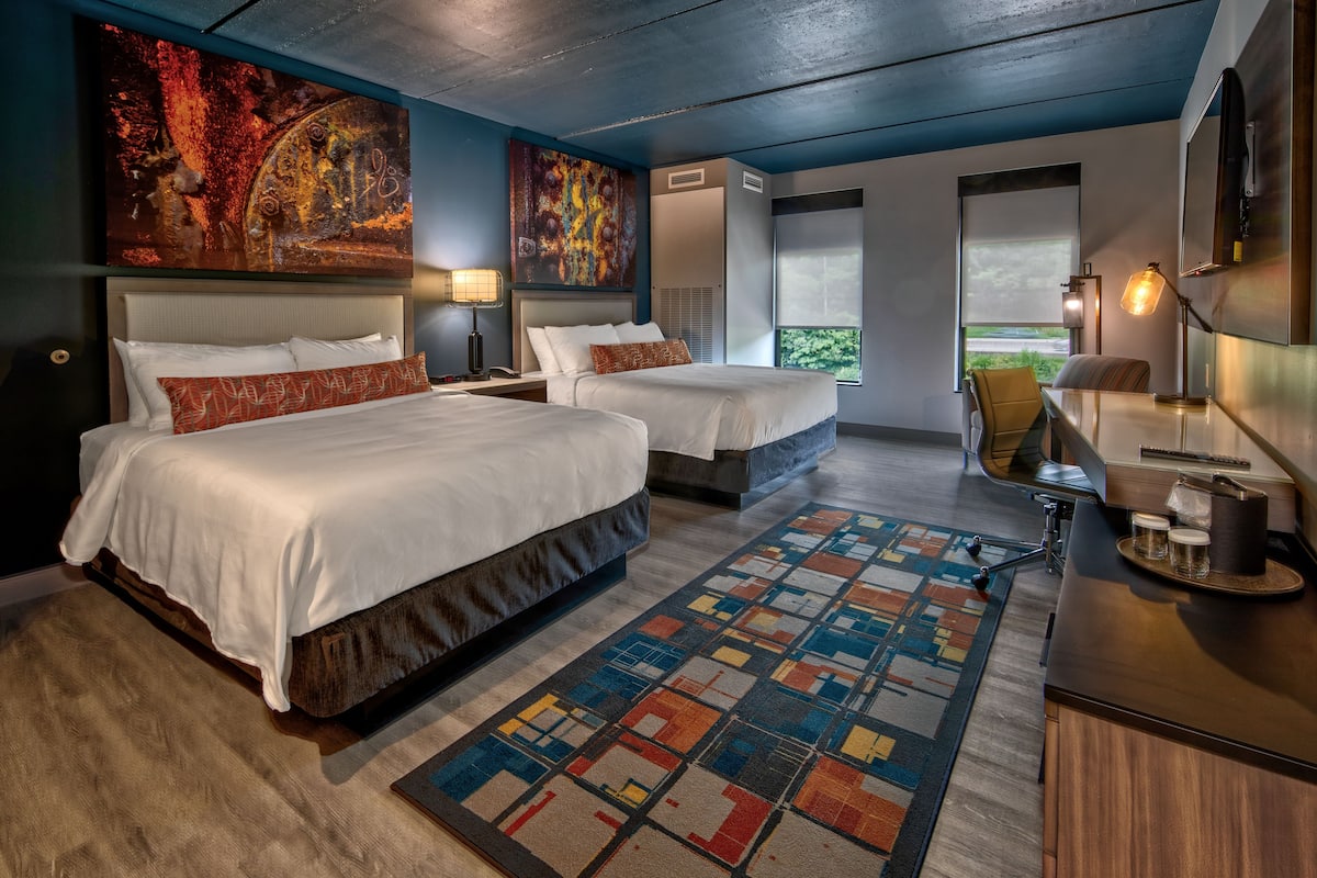 Premium bedding, desk, laptop workspace, blackout curtains