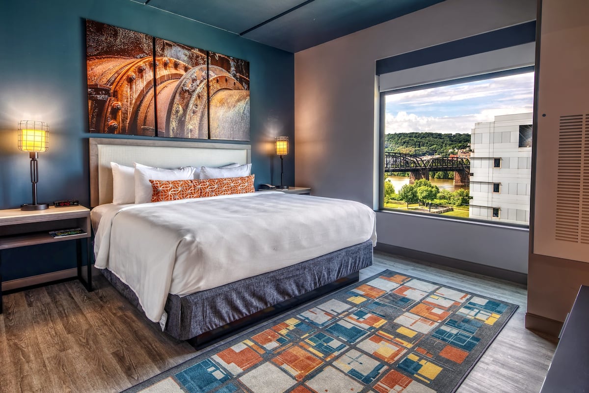 Premium bedding, desk, laptop workspace, blackout curtains