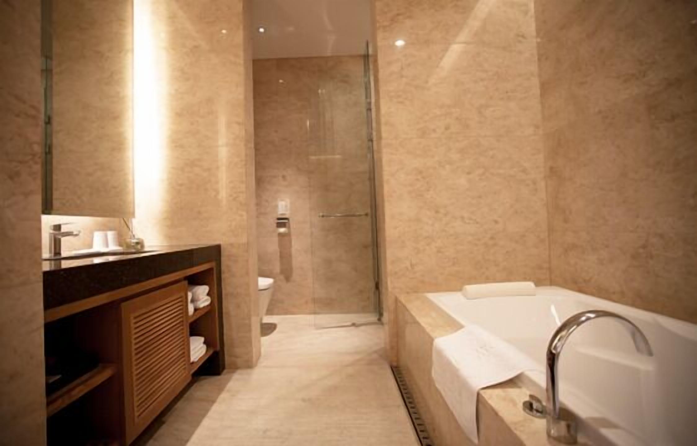 separate bathtub and shower, free toiletries, bathrobes, slippers