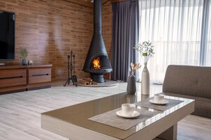 Fireplace Suite | Living room | 75-inch flat-screen TV with cable channels, TV