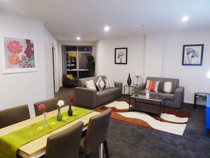 Deluxe Apartment, 1 Bedroom | Living area | Flat-screen TV - Corporate Stayz at Exhibition (Melbourne)