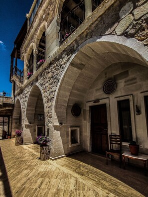 A historic building with arched balconies and stone walls. - Hikmet's House (Avanos)