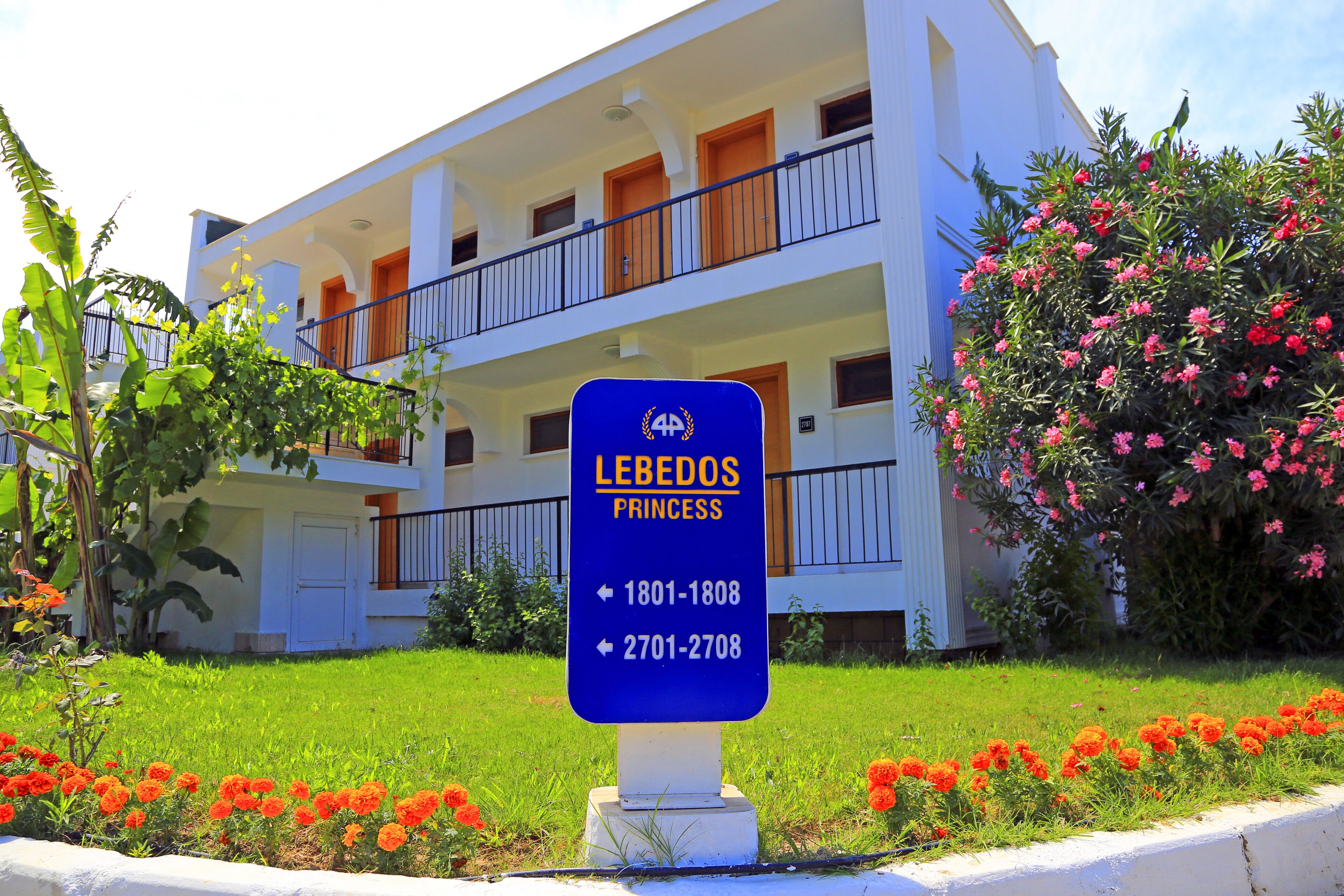 A hotel sign with the name "LEBEDOS PRINCESS" and room numbers 1801-1808 and 2701-2708.