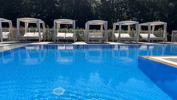 Outdoor pool, a heated pool, pool loungers