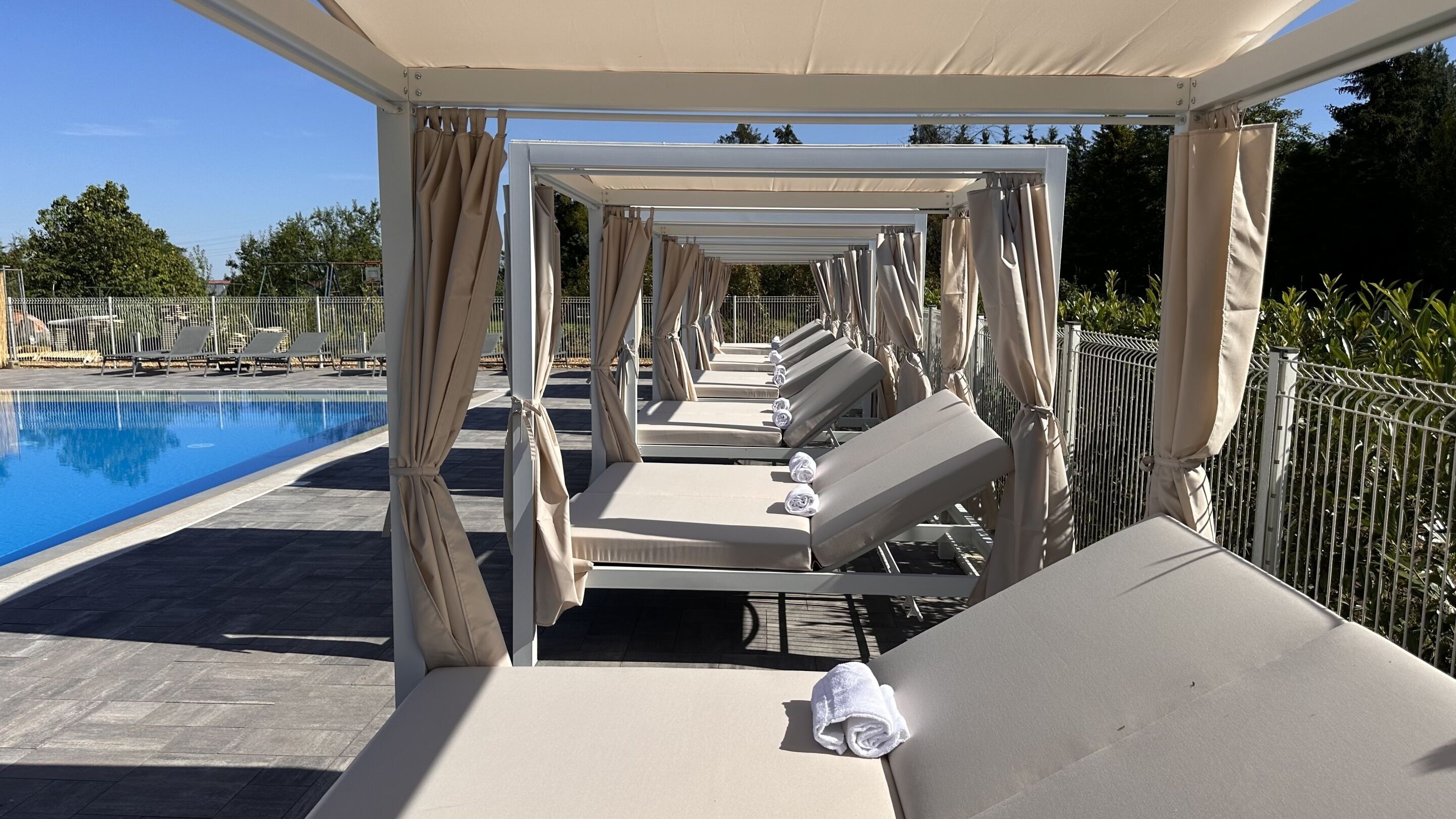Outdoor pool, a heated pool, pool loungers