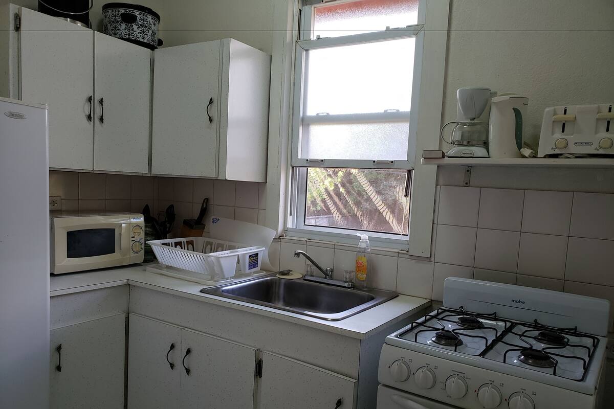 Coffee/tea maker, fridge, microwave, oven