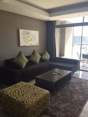 Apartment, 2 Bedrooms (CT502) | Living room | Flat-screen TV