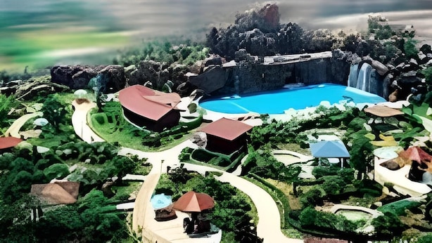 A resort with a central swimming pool, surrounded by lush greenery and various buildings. - Dolton Changsha Spa Hotel (Changsha)
