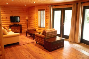 Apartment, 1 Bedroom (Les jardins 1 chambre) | Living area | Flat-screen TV