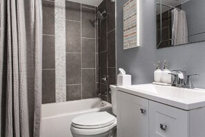 Combined shower/tub, hair dryer, towels, soap