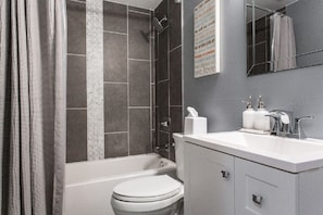 Combined shower/tub, hair dryer, towels, soap