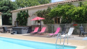A swimming pool with lounge chairs and a barbecue area. - Spacious 3 Bed Gite, Aude, Pool, Hot Tub, Free Wi-fi, Games Room, Pet-Friendly! (Arques)